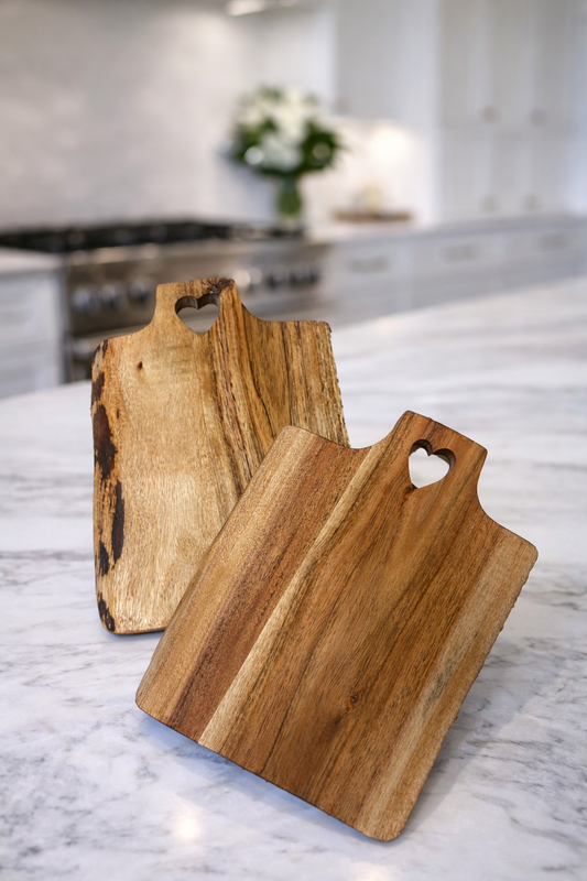 Live edge acacia heart boards showing natural grain and edges