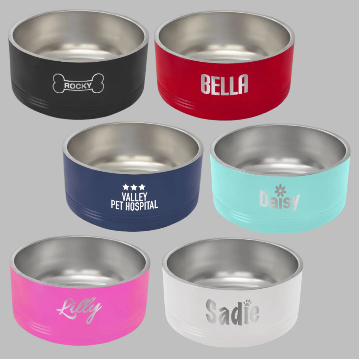 Six stainless steel pet bowls in assorted colors engraved with pet names like Bella