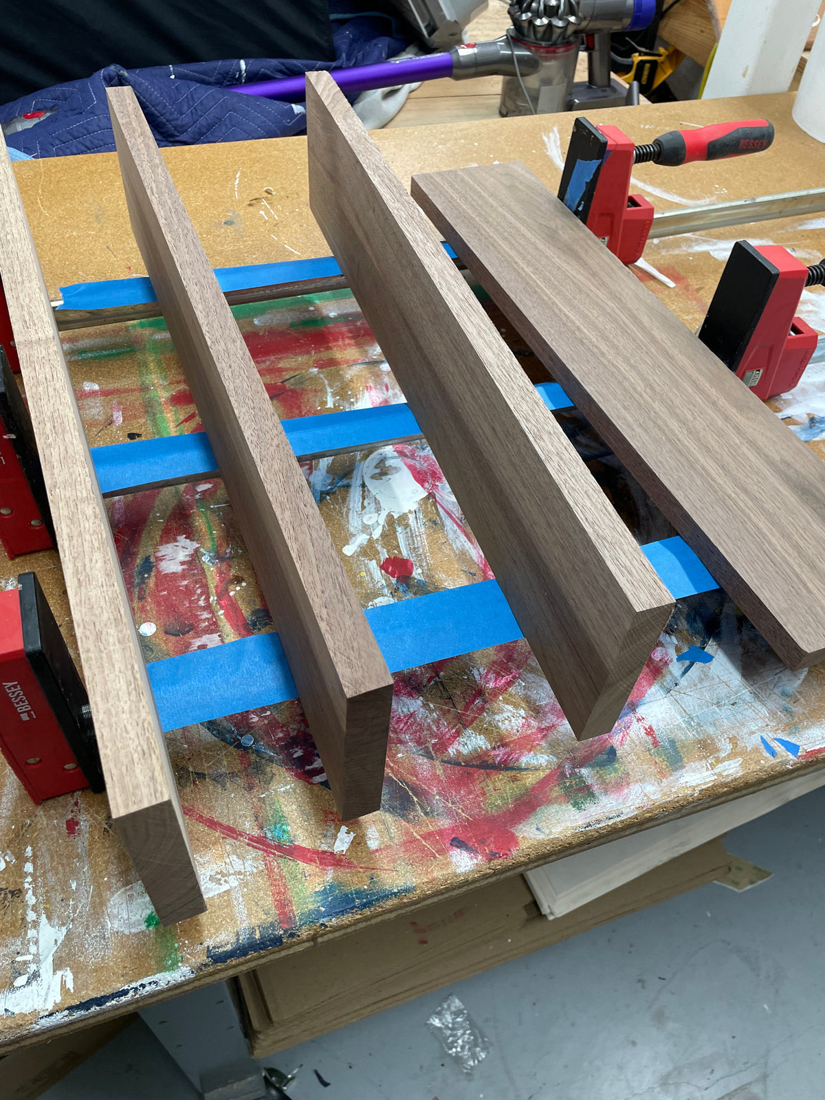 Black walnut boards arranged for glue-up of a 20 inch round serving board