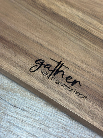 Close-up of laser engraving on acacia wood grain