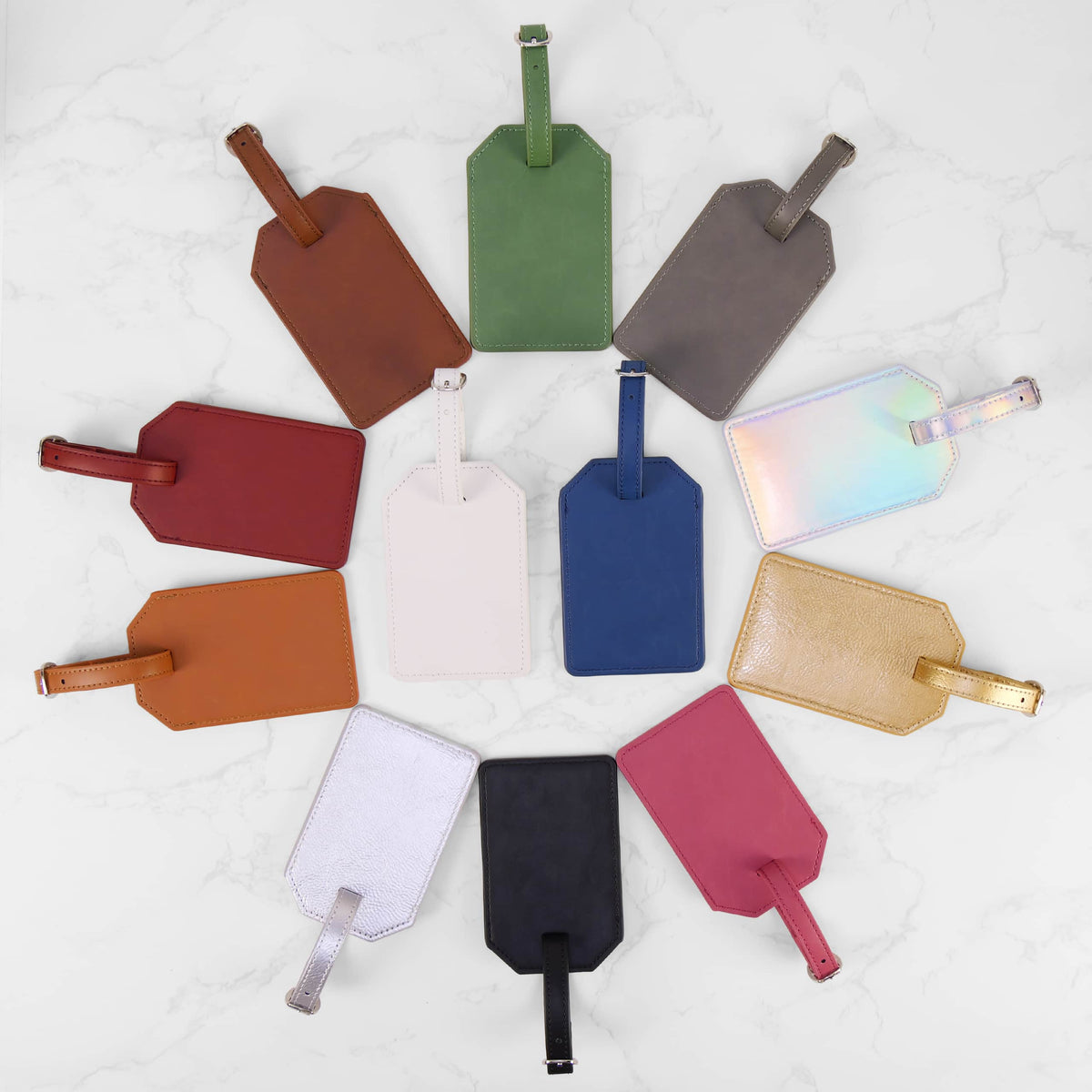 Personalized leatherette luggage tags in twelve colors, custom engraved by Carve & Burn in Miami