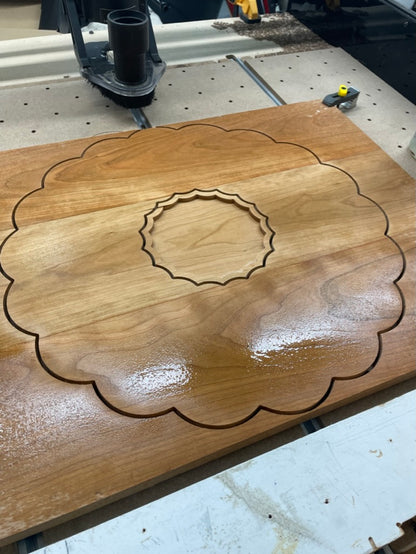 Cherry clamshell charcuterie board cut on the CNC machine with center dish recess