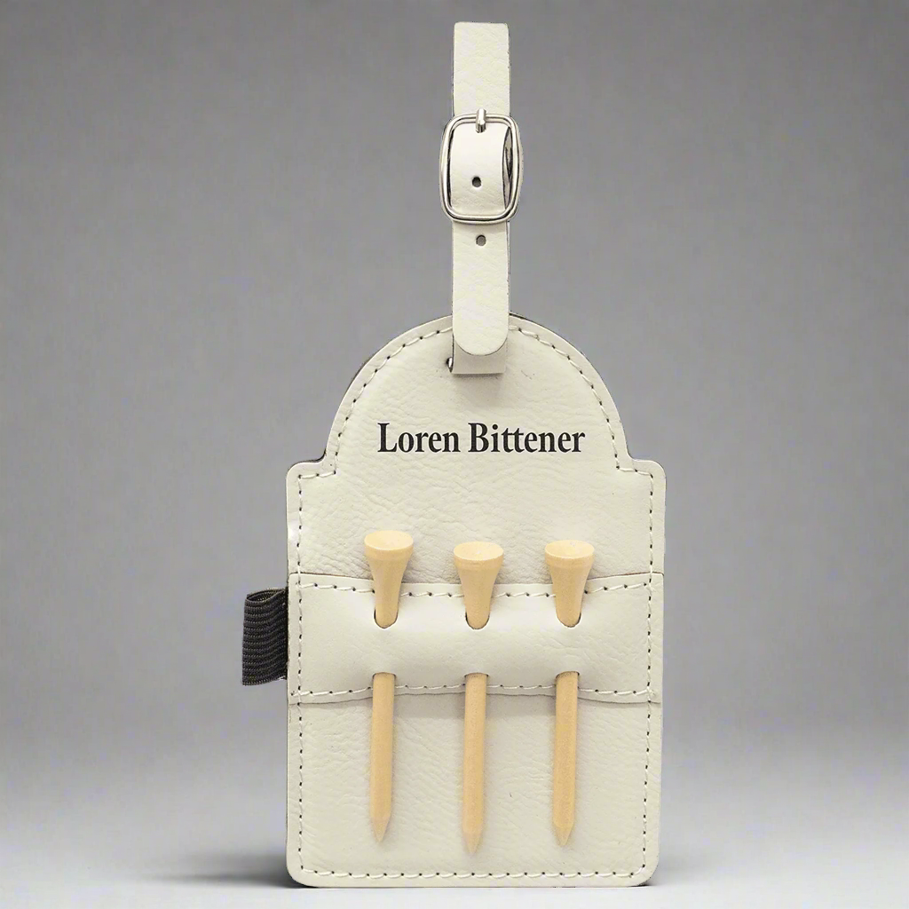 White leatherette golf bag tag with tees engraved with a personal name