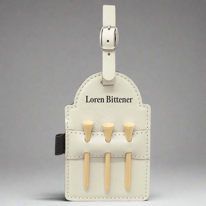 White leatherette golf bag tag with tees engraved with a personal name
