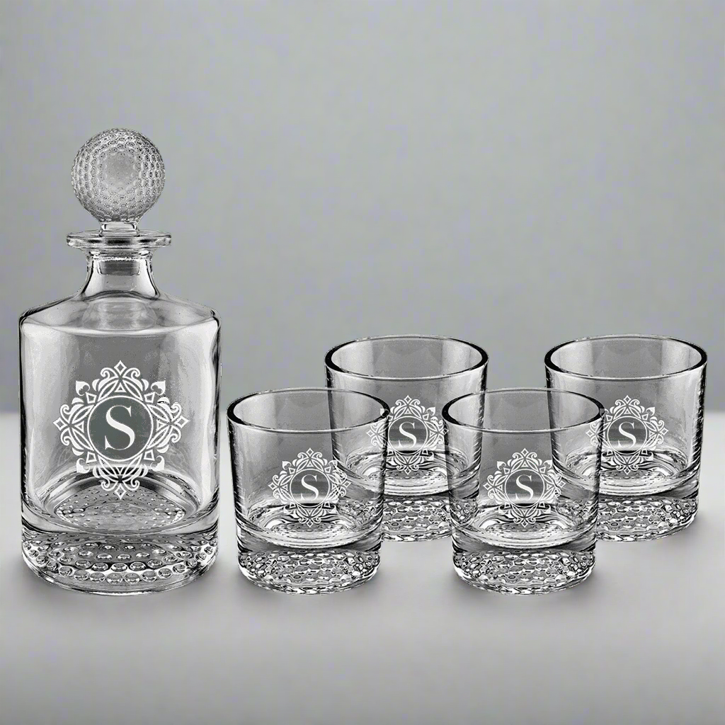 Golf ball decanter set engraved with a monogram on the decanter and glasses