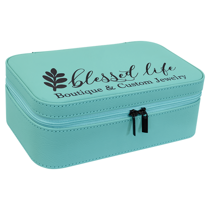 Teal leatherette travel jewelry box engraved with a Blessed Life boutique logo, angled view