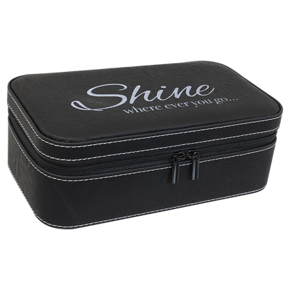 Black leatherette travel jewelry box engraved with a Shine logo