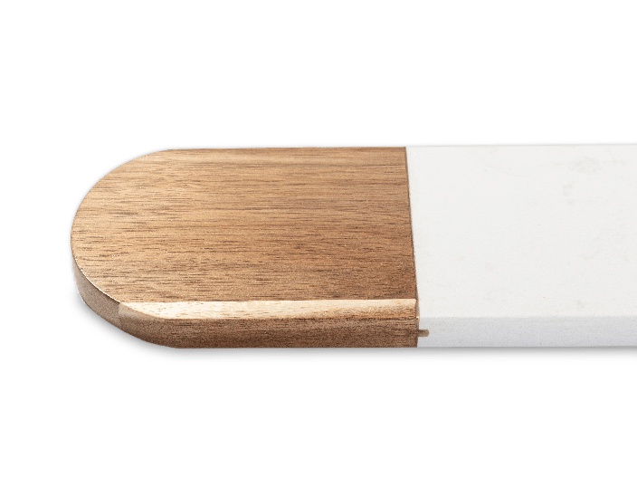 Oval white marble and acacia serving board, close-up of the rounded acacia end