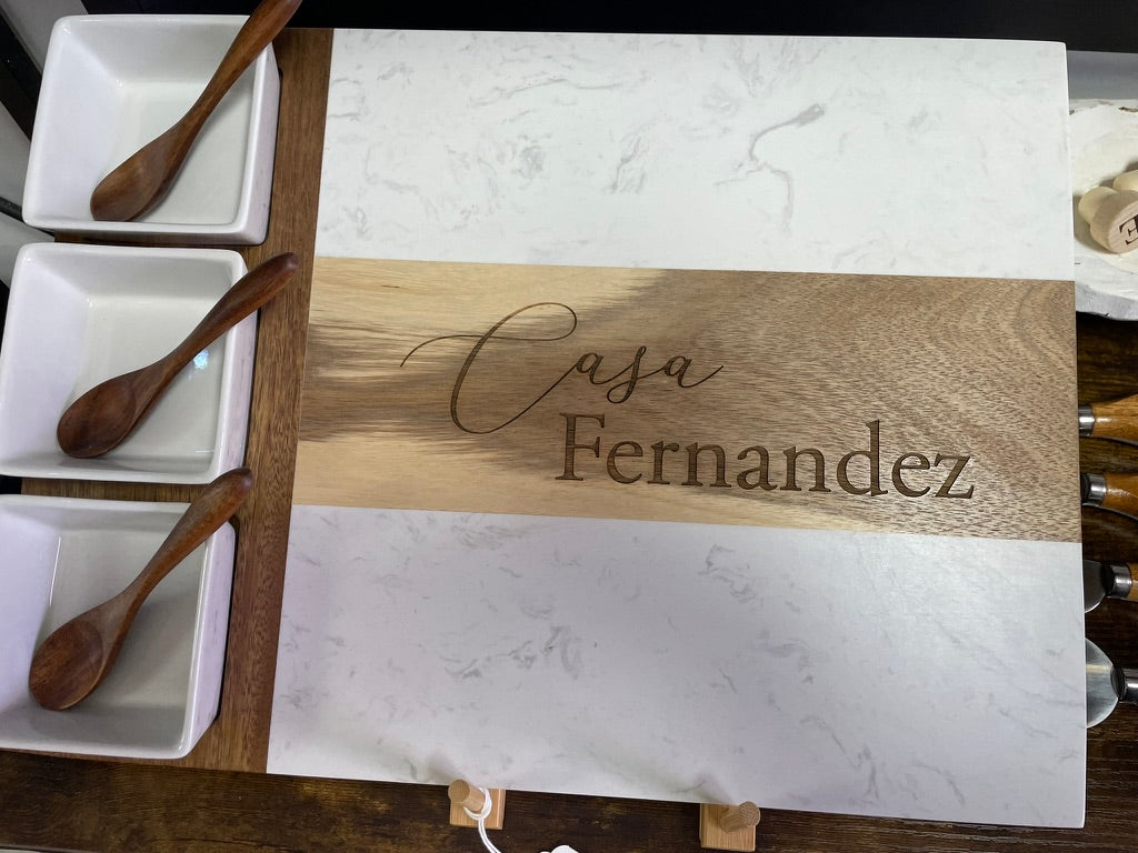 Custom engraved marble and acacia charcuterie board made by Carve & Burn in Miami
