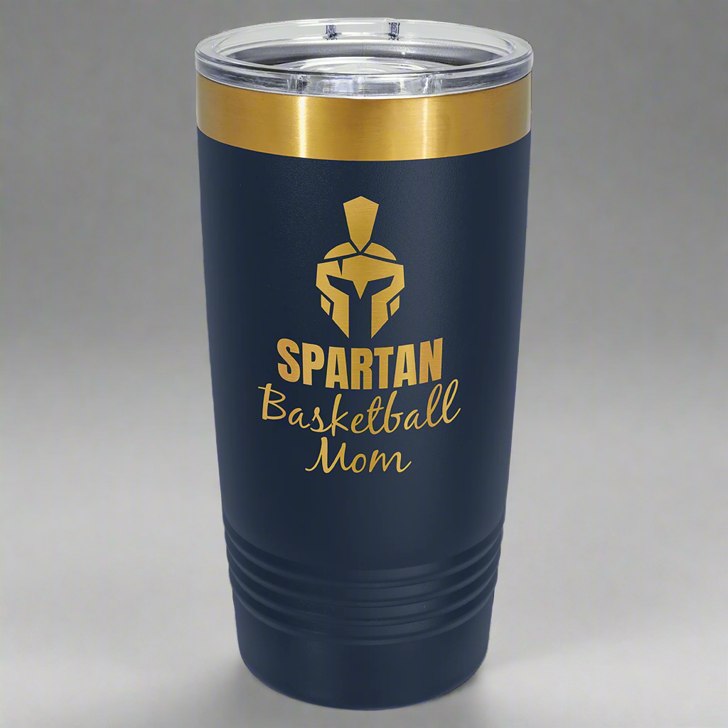 Navy and gold 20 oz gold ion tumbler with a sample laser engraving revealing the gold underneath