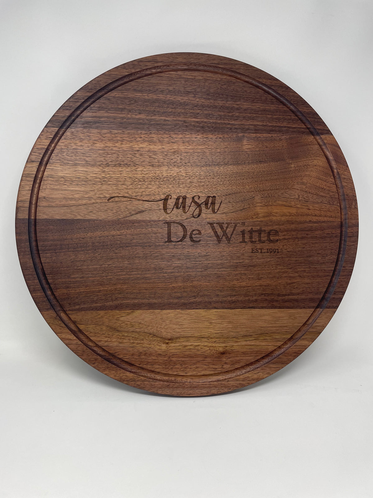 20 inch round black walnut serving board, laser engraved by Carve & Burn in Miami