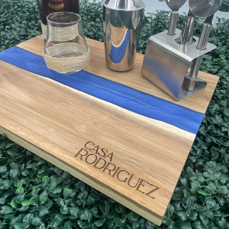 Personalized acacia wood and blue pearl resin charcuterie board, laser engraved by Carve & Burn in Miami