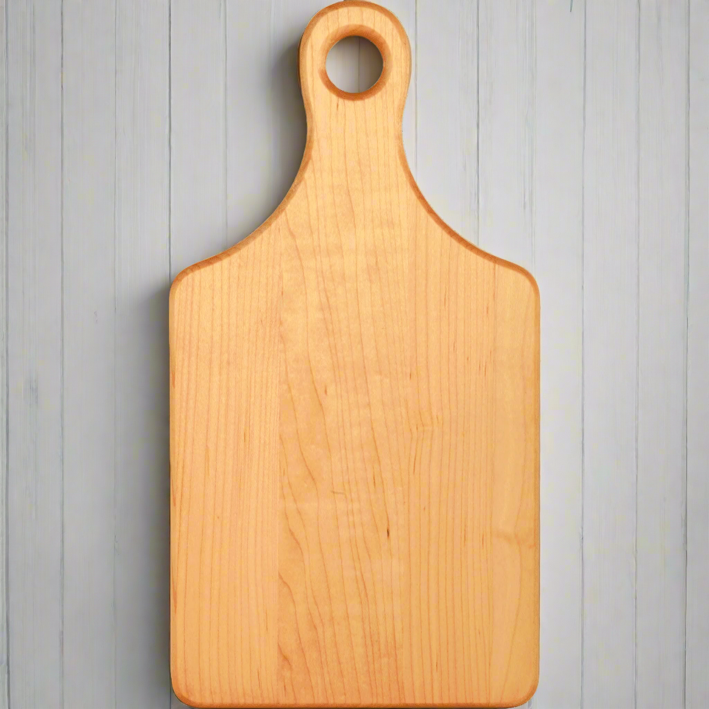 Personalized 13 1/2 x 7 inch maple paddle cutting board with handle, laser engraved by Carve & Burn in Miami