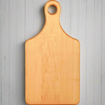 Personalized 13 1/2 x 7 inch maple paddle cutting board with handle, laser engraved by Carve & Burn in Miami
