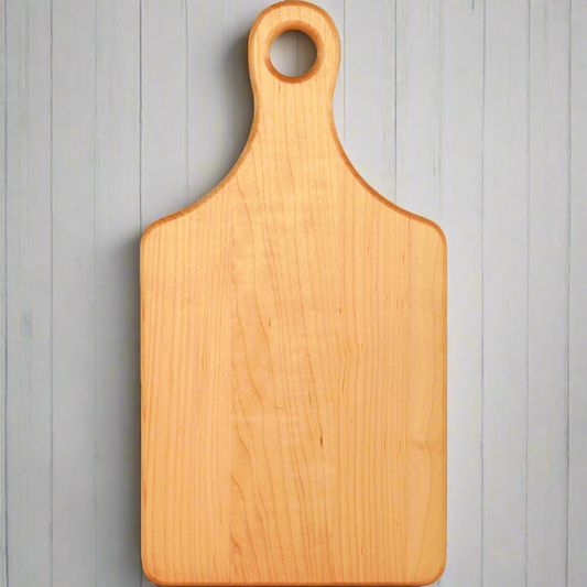 Personalized 13 1/2 x 7 inch maple paddle cutting board with handle, laser engraved by Carve & Burn in Miami