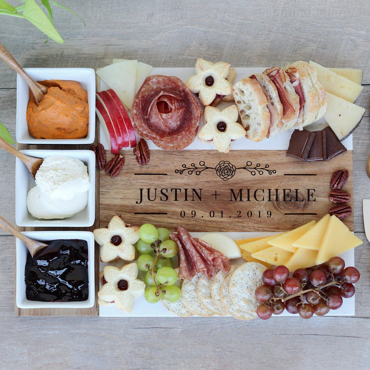 Personalized marble and acacia wood charcuterie board set, laser engraved by Carve & Burn in Miami