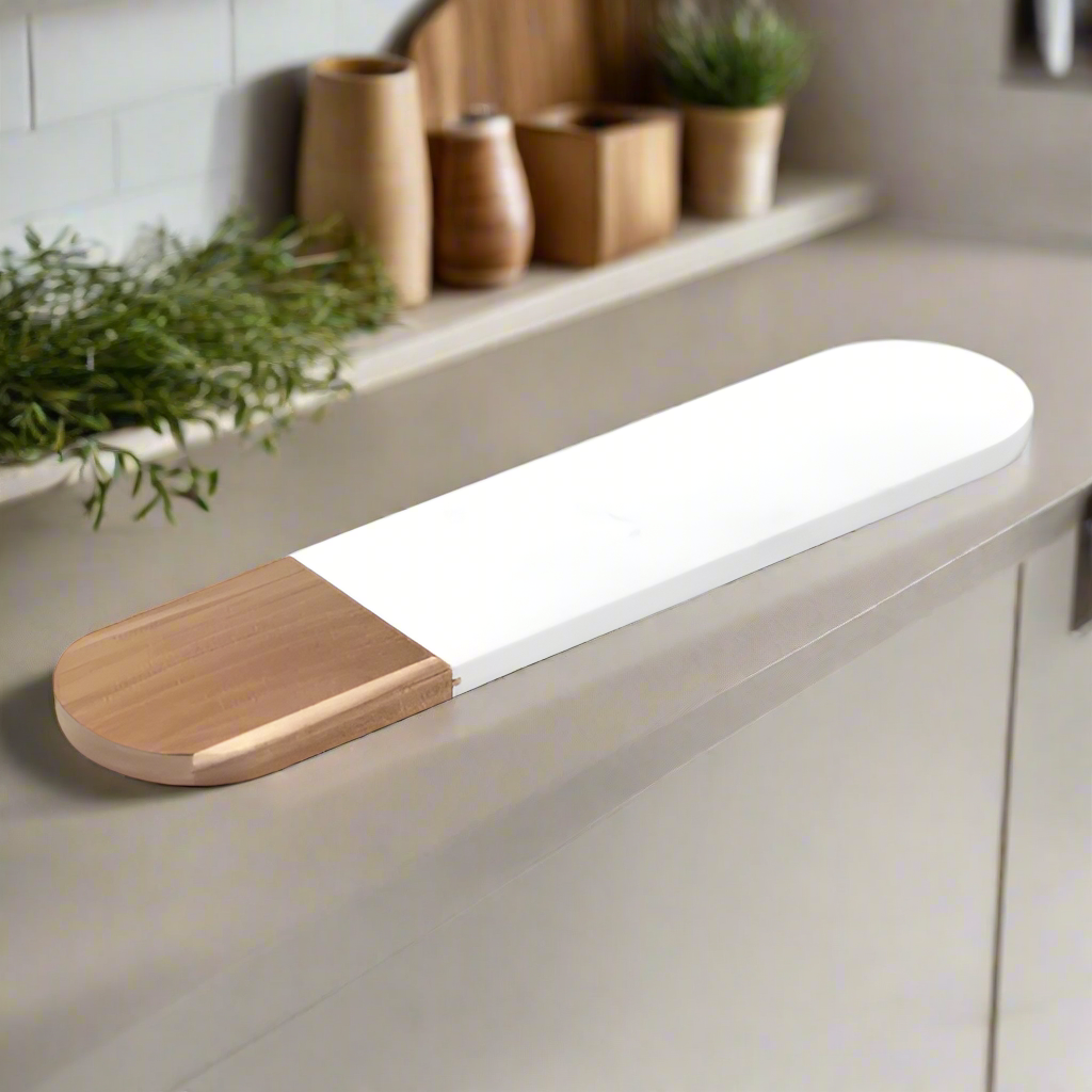 Oval white marble and acacia serving board, laser engraved by Carve & Burn in Miami