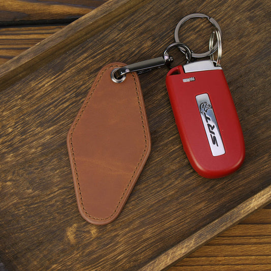 Rawhide leatherette retro motel keychain attached to car keys