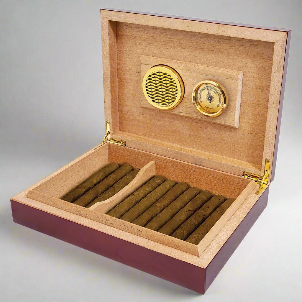 Open rosewood piano finish cigar humidor with cigars, cedar lining and hygrometer