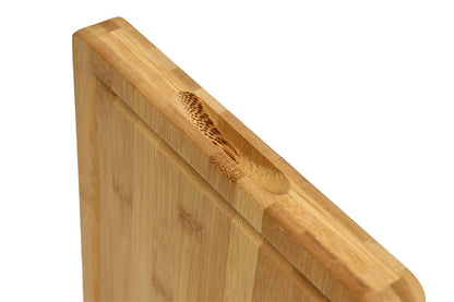 Bamboo cutting board with juice groove, edge view showing 1.25 inch thickness