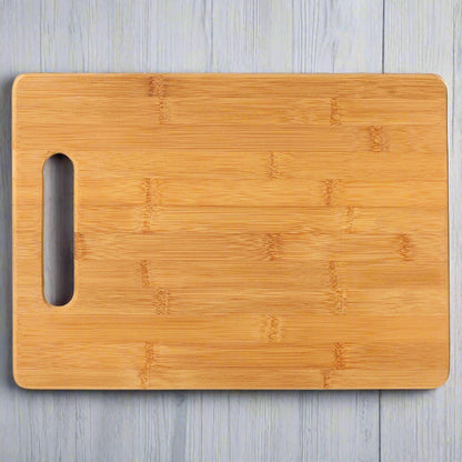 Bamboo rectangle cutting board with handle cutout, ready for custom engraving