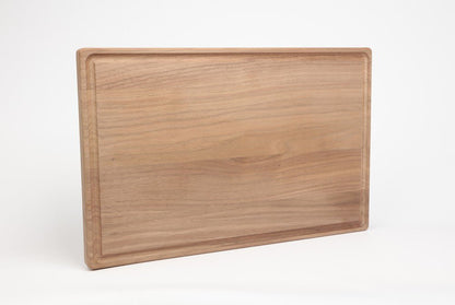 Black walnut 11 x 17 inch cutting board with juice groove, top view