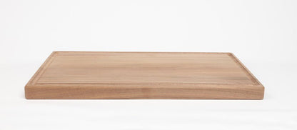 Black walnut 11 x 17 inch cutting board, side profile showing thickness