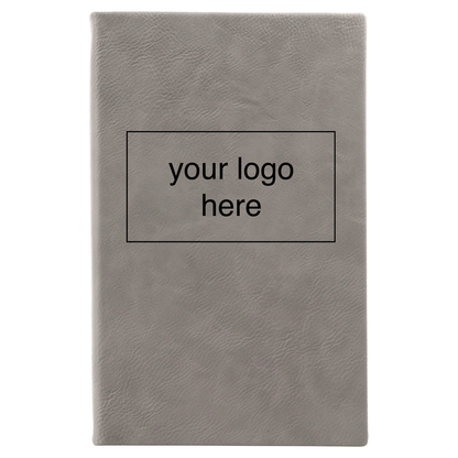 Gray leatherette journal mockup showing a logo engraving placement