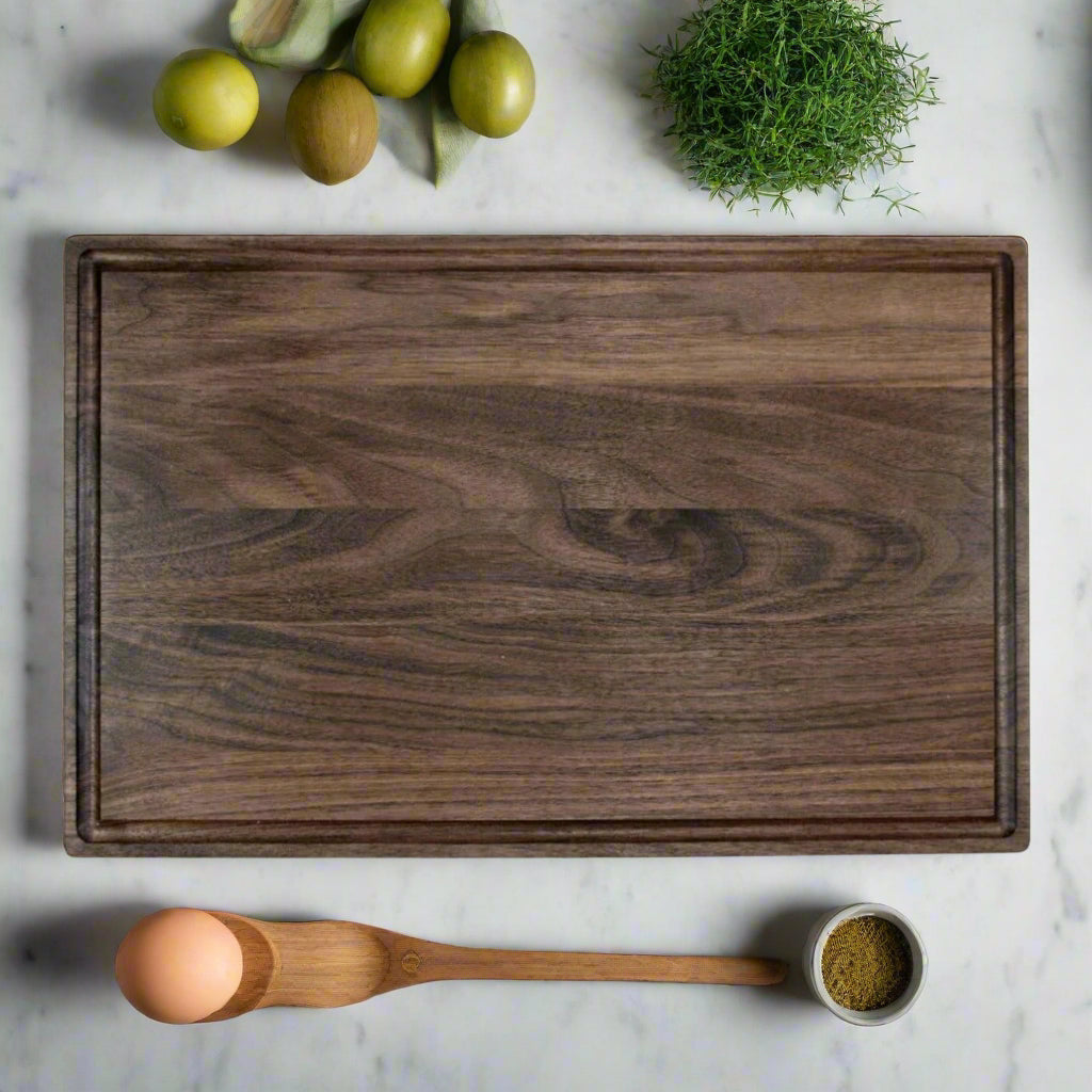 Black walnut cutting board, laser engraved by Carve & Burn in Miami