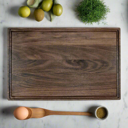 Black walnut cutting board, laser engraved by Carve & Burn in Miami