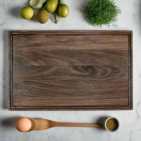 Black walnut cutting board, laser engraved by Carve & Burn in Miami