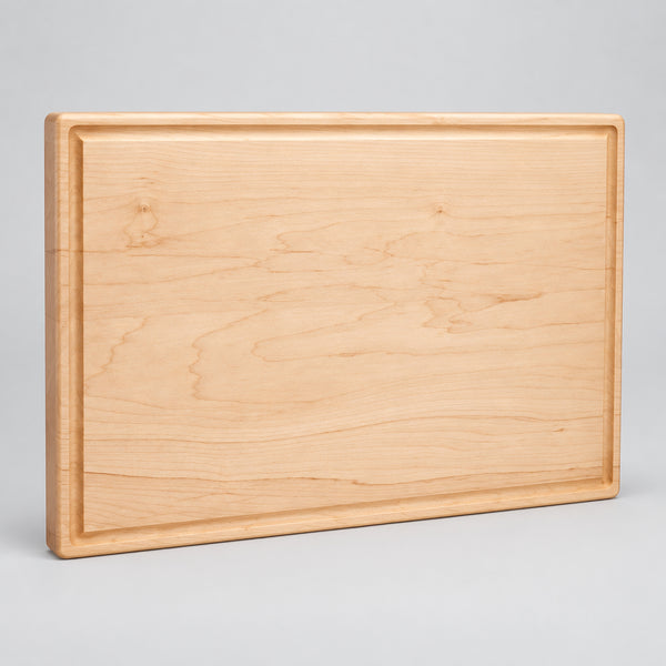 Personalized 11 x 17 inch solid maple cutting board with juice groove, laser engraved by Carve & Burn in Miami