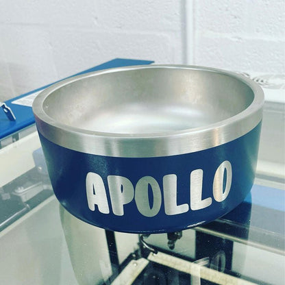 Navy stainless steel dog bowl laser engraved with the name Apollo in block letters