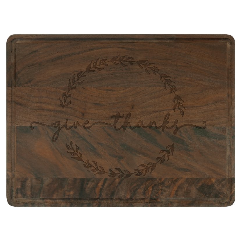 Walnut cutting board with drip ring engraved with a wreath and family name